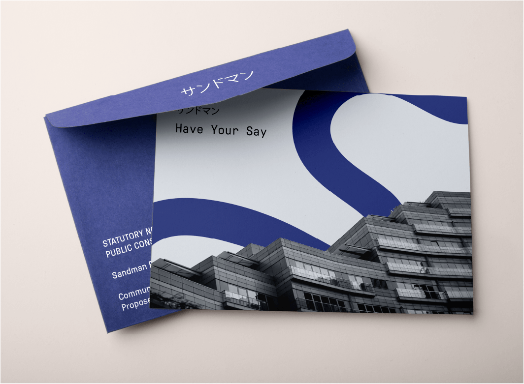 A custom blue envelope for a construction company called sandman. The envelope is blue with white text, and the enclosed postcard features a modern construction image, in black and white