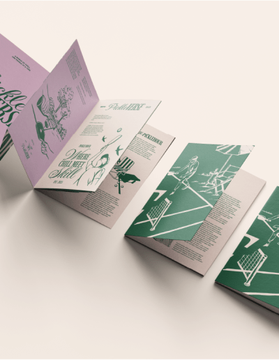 A 12 sided A6 roll fold leaflet. Each side has 6 panels. This leaflet is for a pickleball club, and features beige, breen and light pink text and illustrations